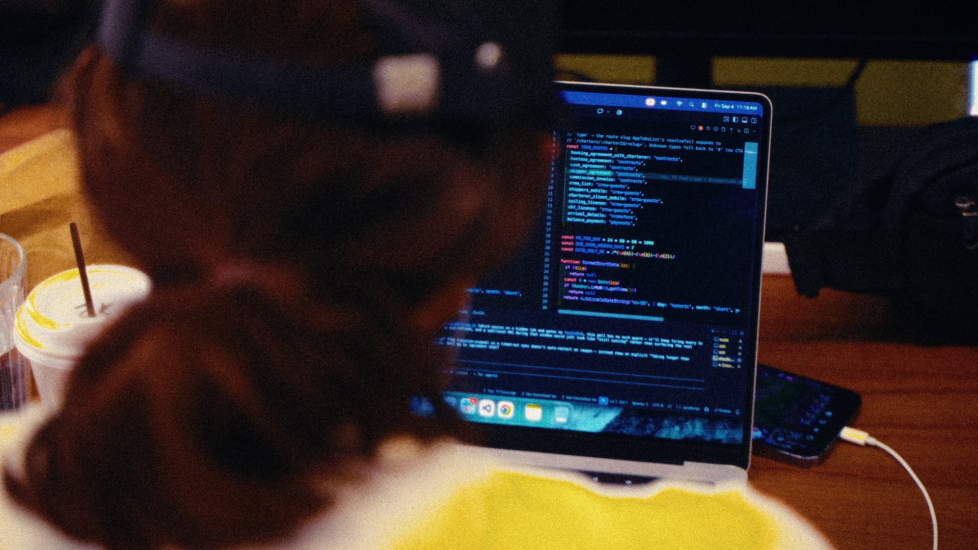 A marketer working alongside AI tooling in a code editor