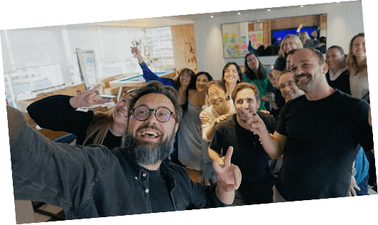 The REBORRN team throwing up peace signs during a company session