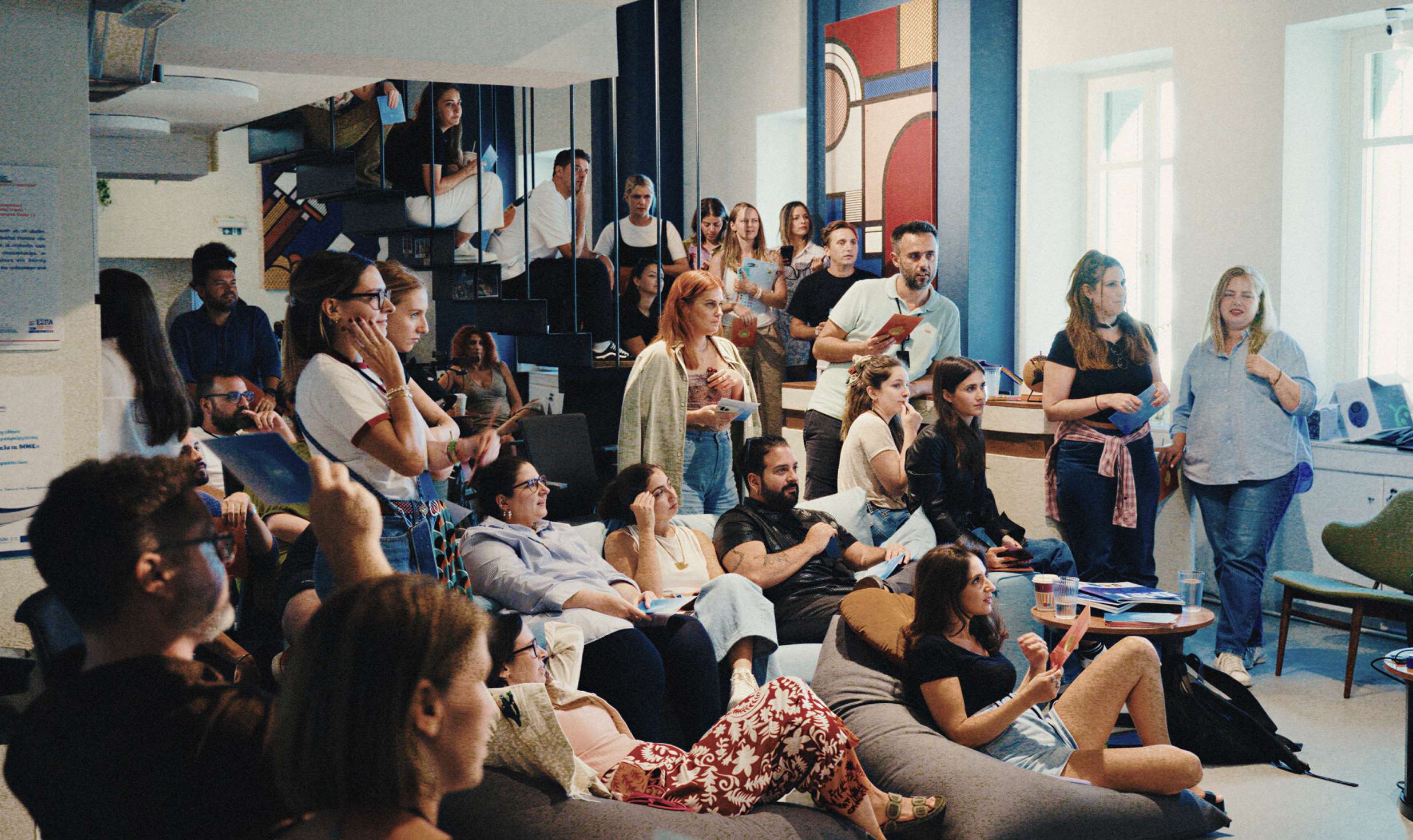 The REBORRN team gathered in their studio during a company-wide session
